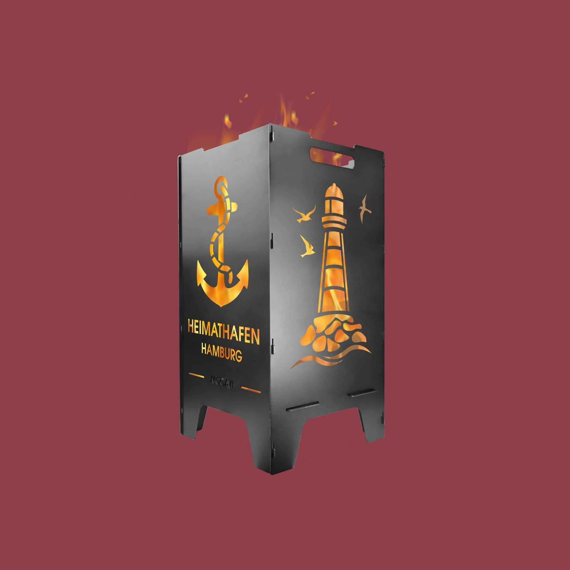 MOCAVI Feuertonne, seitliche Ansicht der Motive Heimathafen mit Personalisierung und Leuchtturm vor altrosafarbenem Hintergrund.